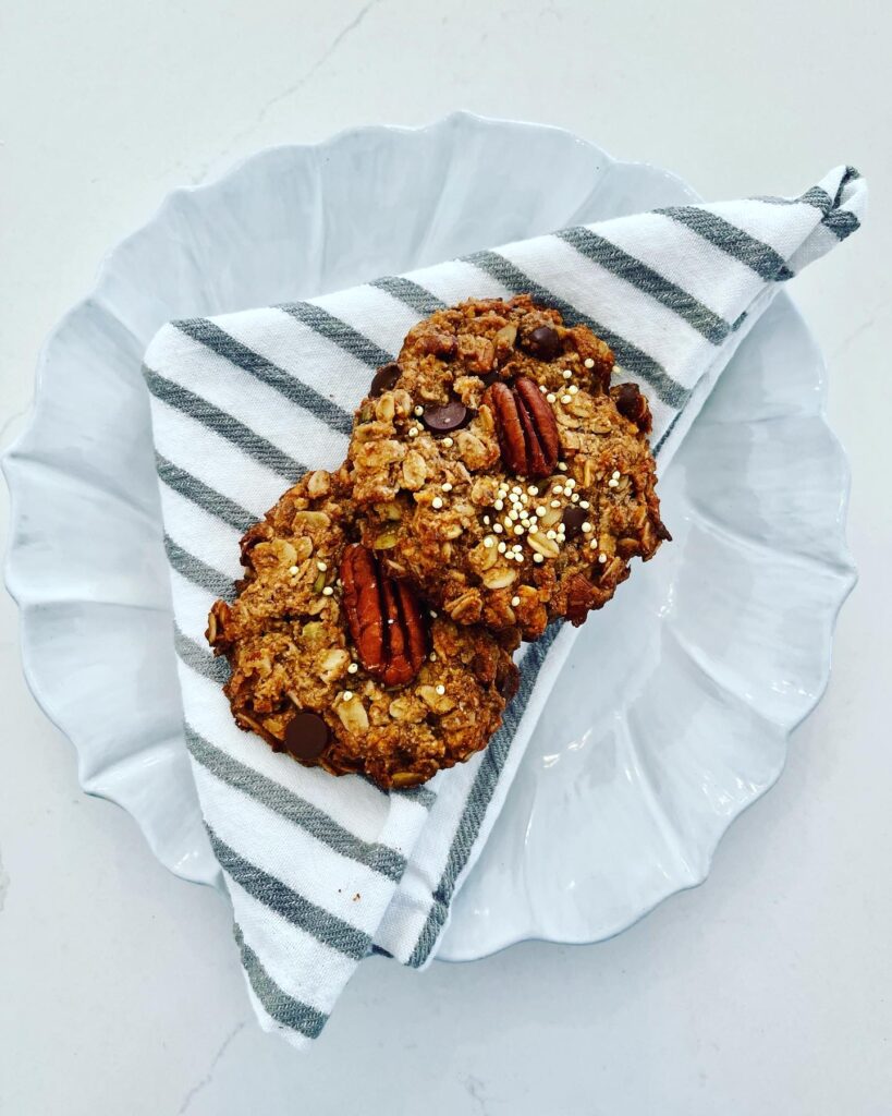 2 Nutty Breakfast Cookies on a cloth napkin, on a plate.